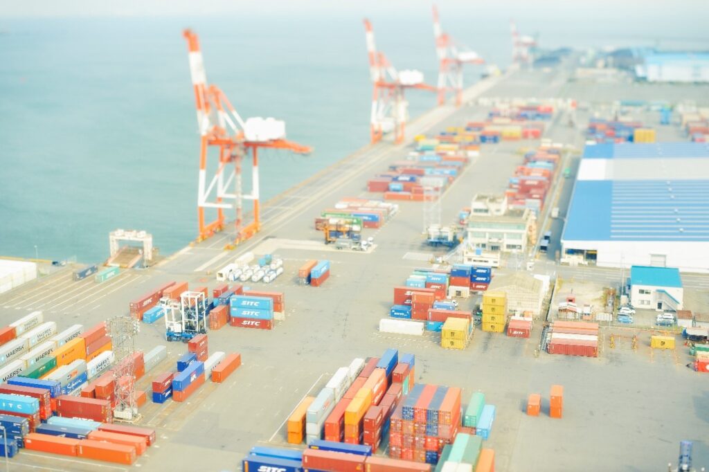Container port with cranes and warehouses from a distance