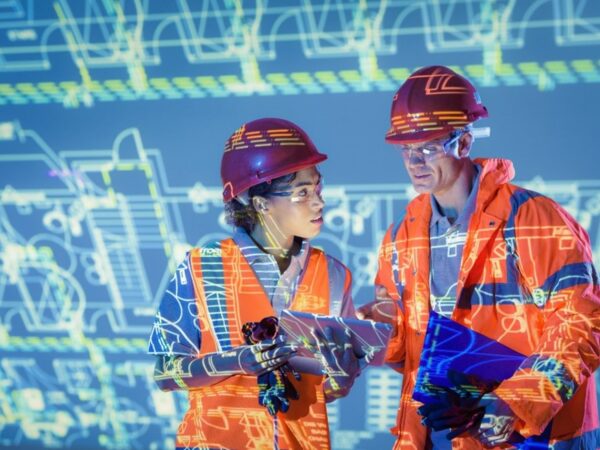 Two people wearing hi-vis and hard hats against a digital background