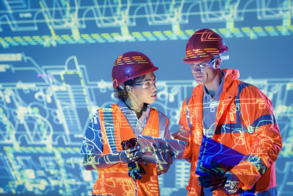 Two people wearing hi-vis and hard hats against a digital background